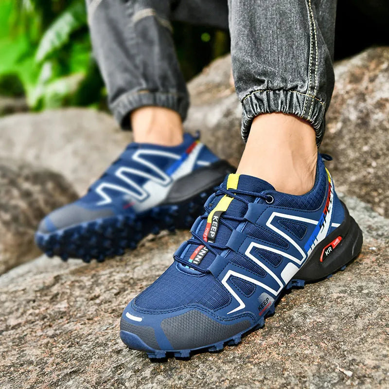 Men's gray orange casual running shoe with synthetic leather upper and low-top design.