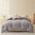Soybean fibre filled quilt with pure cotton cover in grey, showing twill weave texture on a bed.