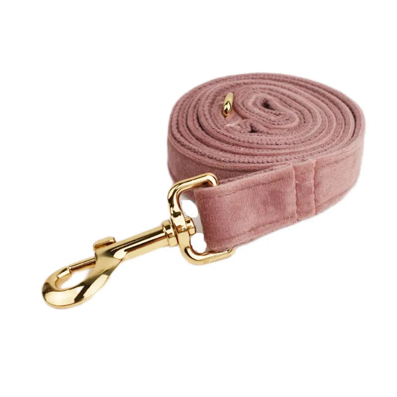 Light purple and pink velvet dog collar with matching leash and bow accessory set on a white background.