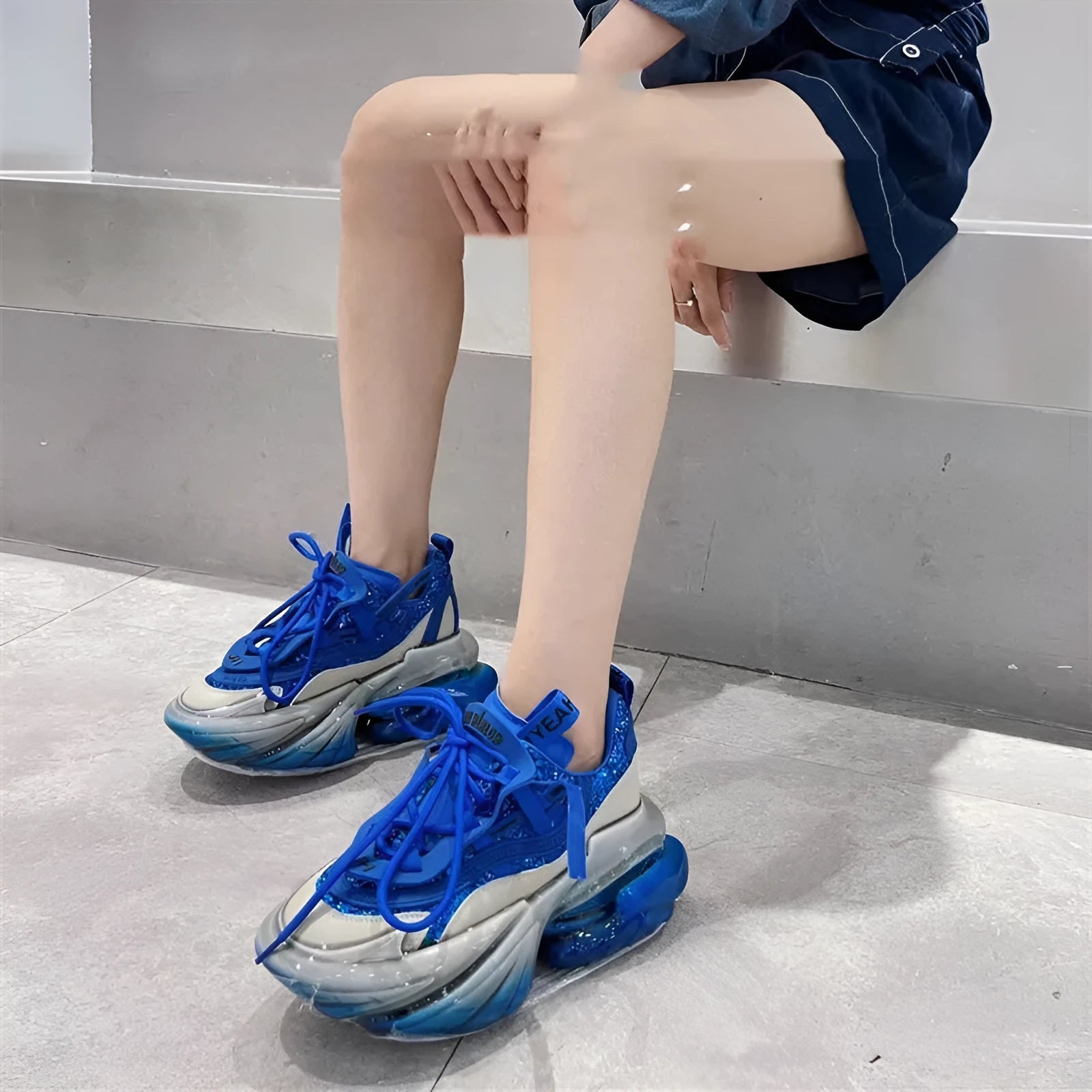 Women's leather jelly shoes with thick sole and cross-tie detail in green, blue, white, purple, or black.
