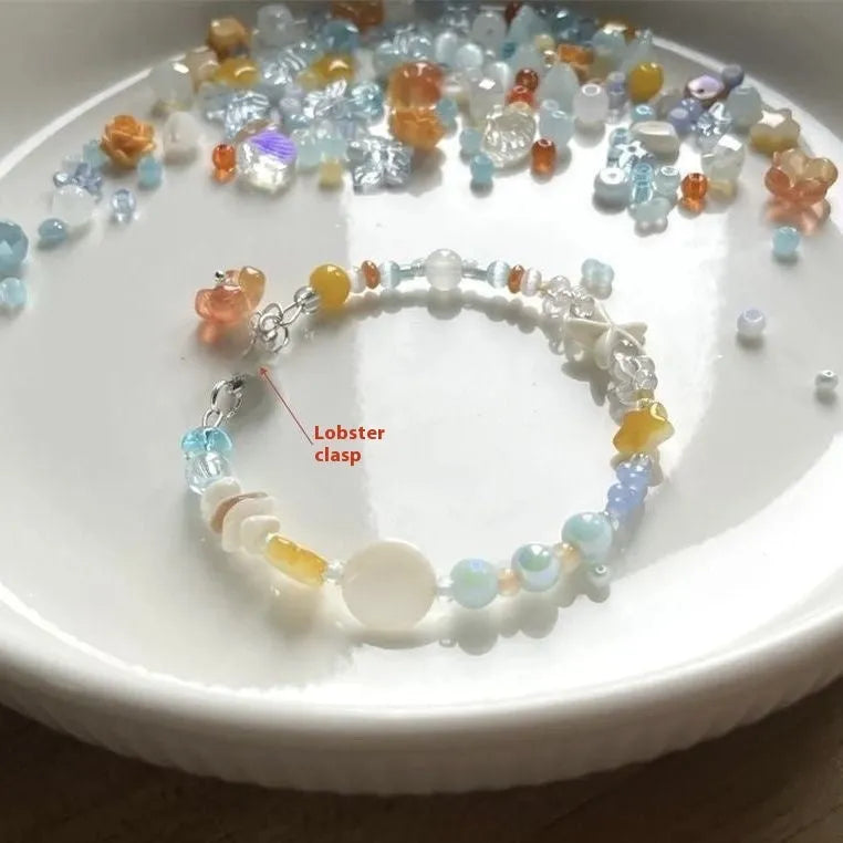Orange alloy charm bracelet with mixed materials, diamond and round elements, adjustable seaside summer design