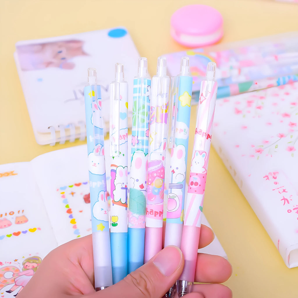 Set of six white plastic pens with black caps and a cartoon bunny character printed on the barrel.