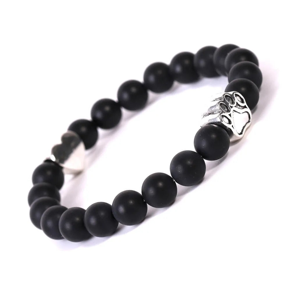Tigereye Indian Agate stone bracelet with dog paw and love heart charms on wrist.