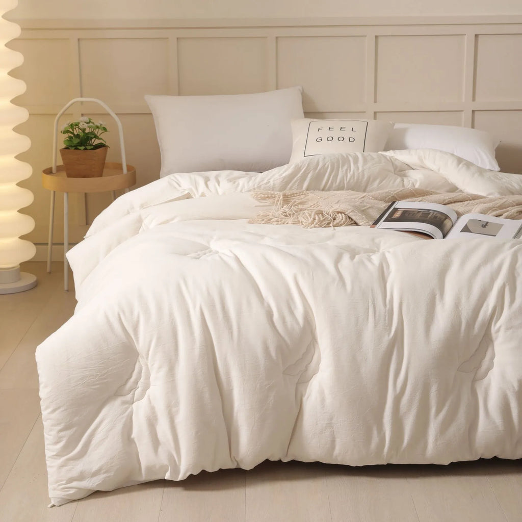 Soybean fibre filled quilt with pure cotton cover in grey, showing twill weave texture on a bed.