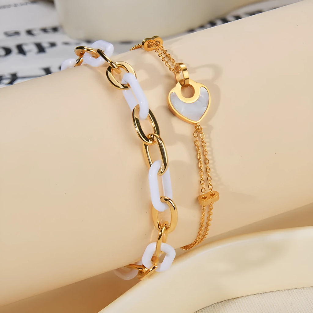 Women's stainless steel bracelet with a double-layered resin heart shape and electroplated finish.