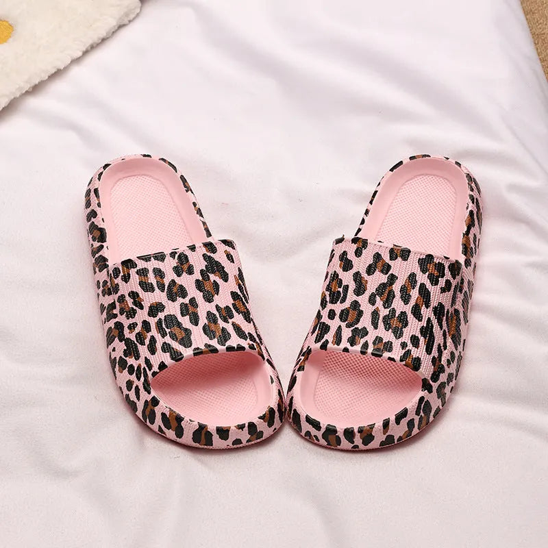 Women's leopard print slipper with thick EVA sole shown in multiple colour and print options.