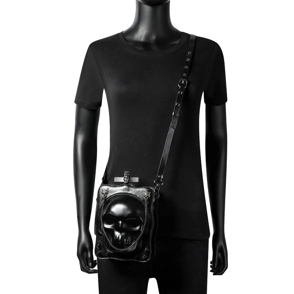Black gothic skull mini crossbody bag with stitching and chain details