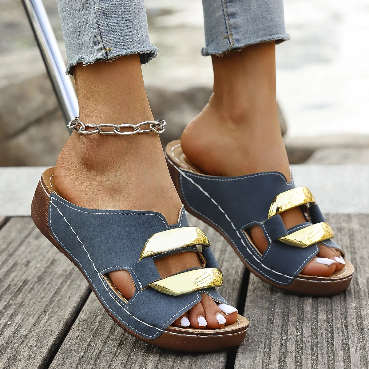 Adult Roman style platform sandals in a solid colour with a strap design and flat rubber sole.