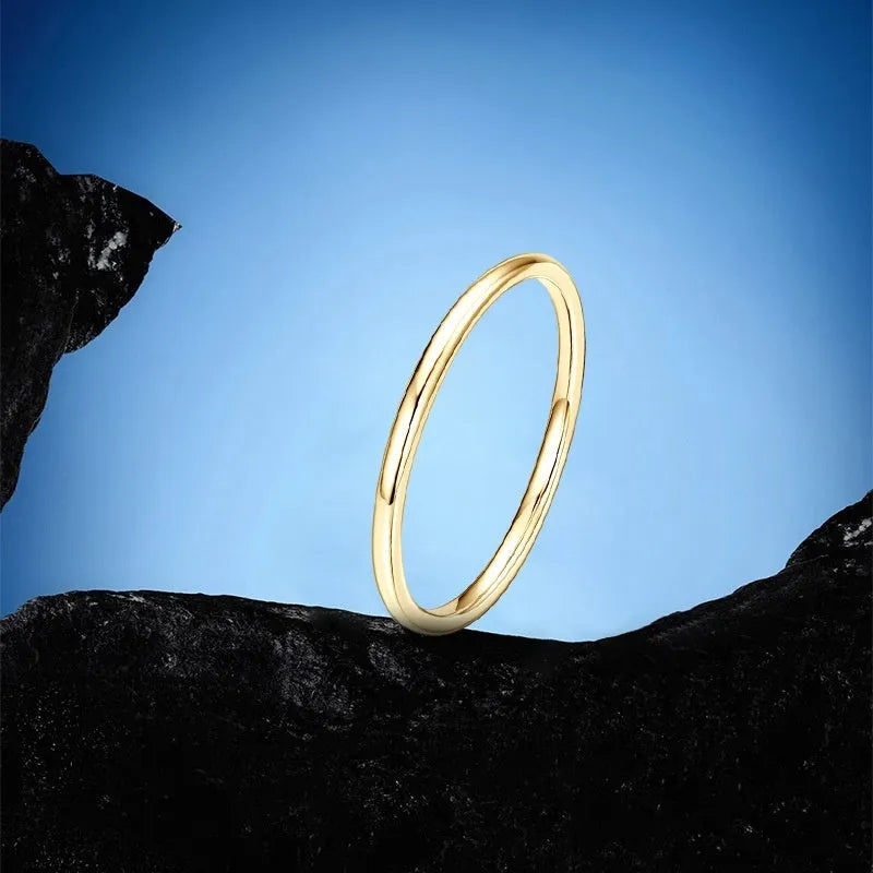 Geometric round bracelet ring in sterling silver, gold, or platinum finish on a jewellery display.