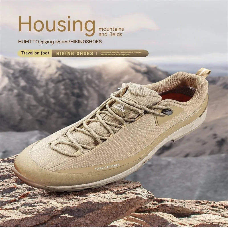 Men's low-top hiking boots in black with a leather mesh upper and rugged rubber outsole.