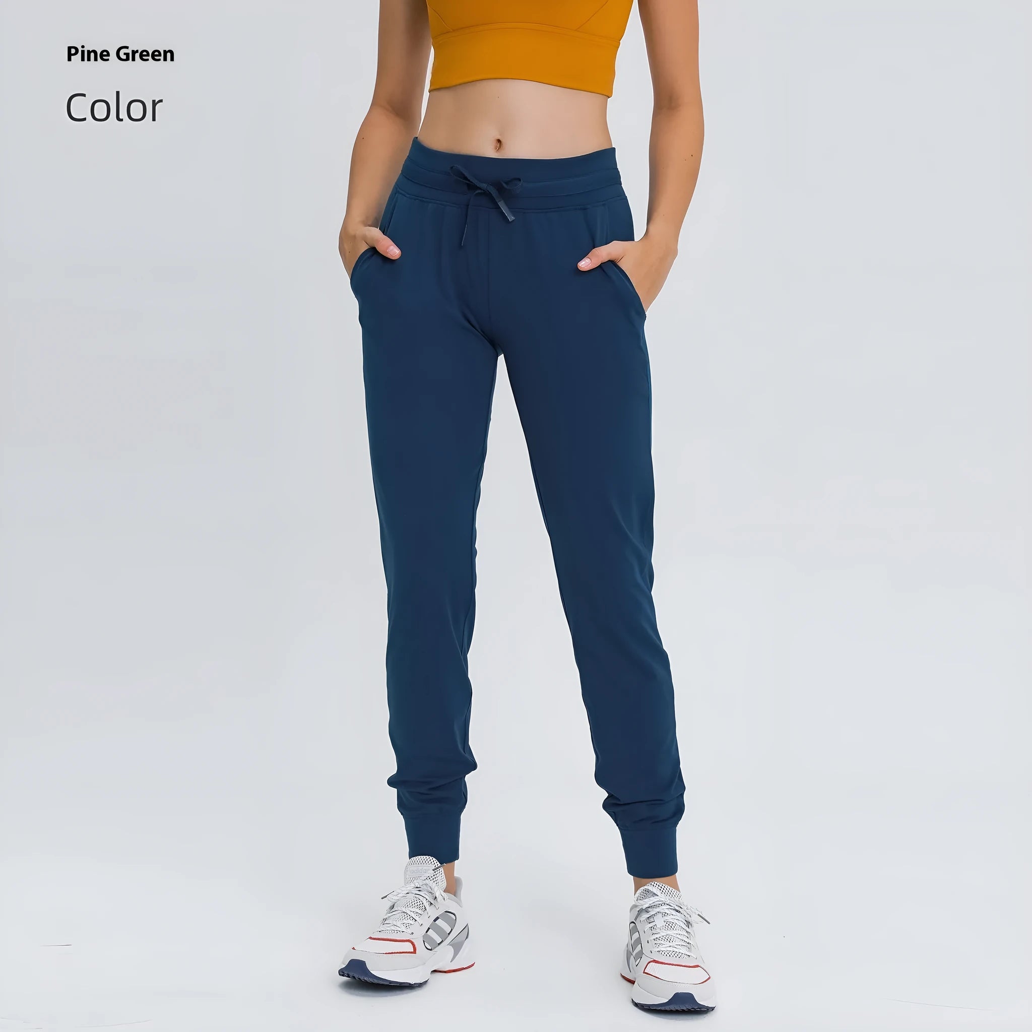 Women's high-waist yoga pants with drawstring waistband in a cotton blend fabric.