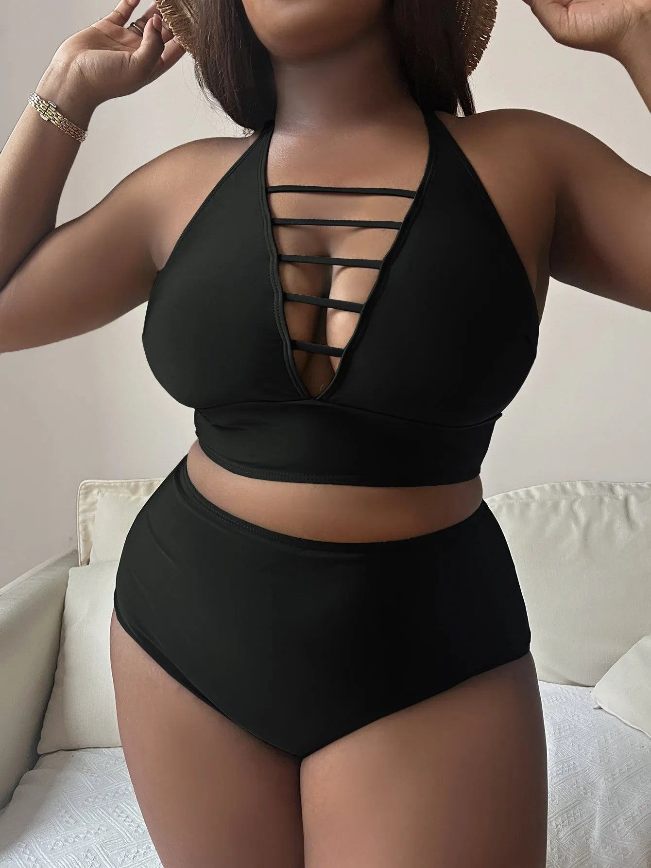 Plus size woman in a solid green halter bikini with adjustable straps and high waist briefs.