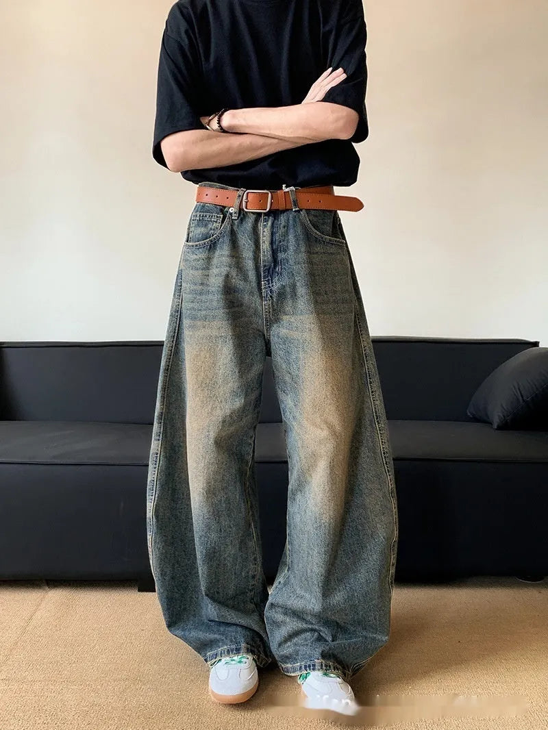 Men's retro blue distressed denim wide-leg jeans with a slimming fit and zip fly