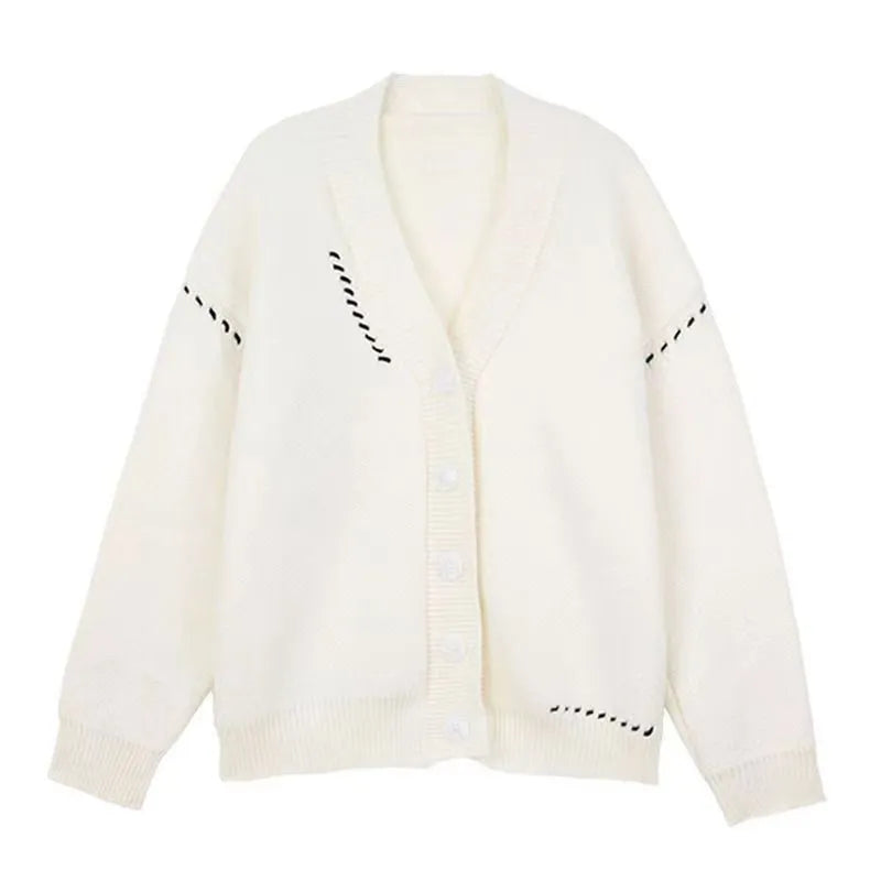 Women's loose fit black knitted cardigan top coat with long sleeves, hanging on a hanger.