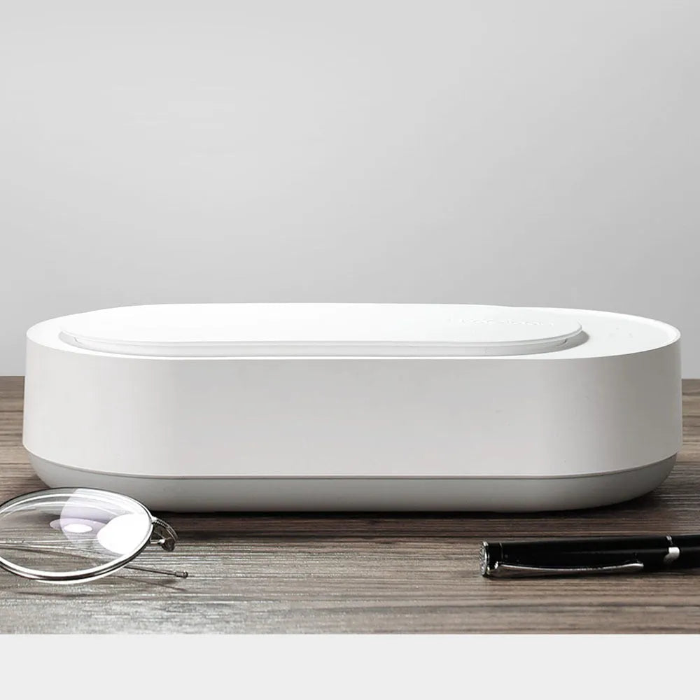 White portable ultrasonic cleaning machine with stainless steel tank and touch button.