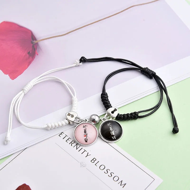 Alloy couple bracelets with magnet closure showing various design options including crown, clover, and text patterns