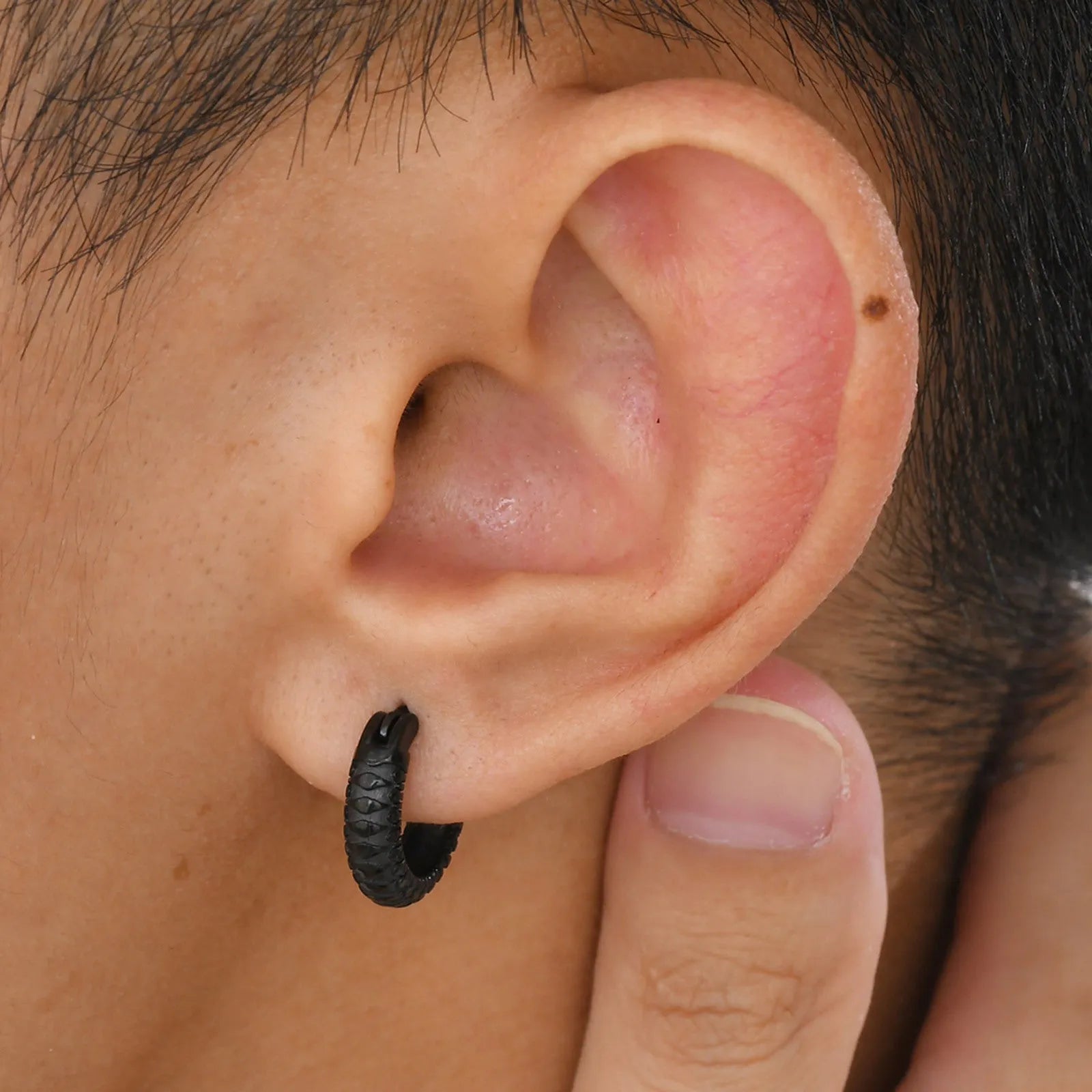 Stainless steel snake pattern earrings with butterfly clip fastening in black or gold finish