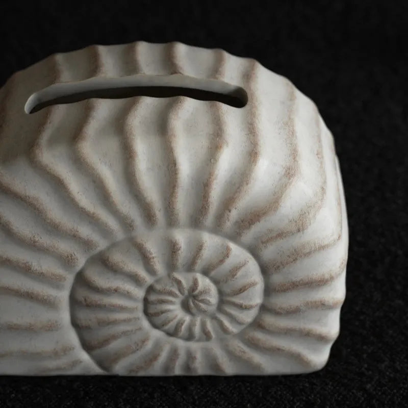 Modern minimalist resin tissue box holder in a conch ramble colour and pattern.