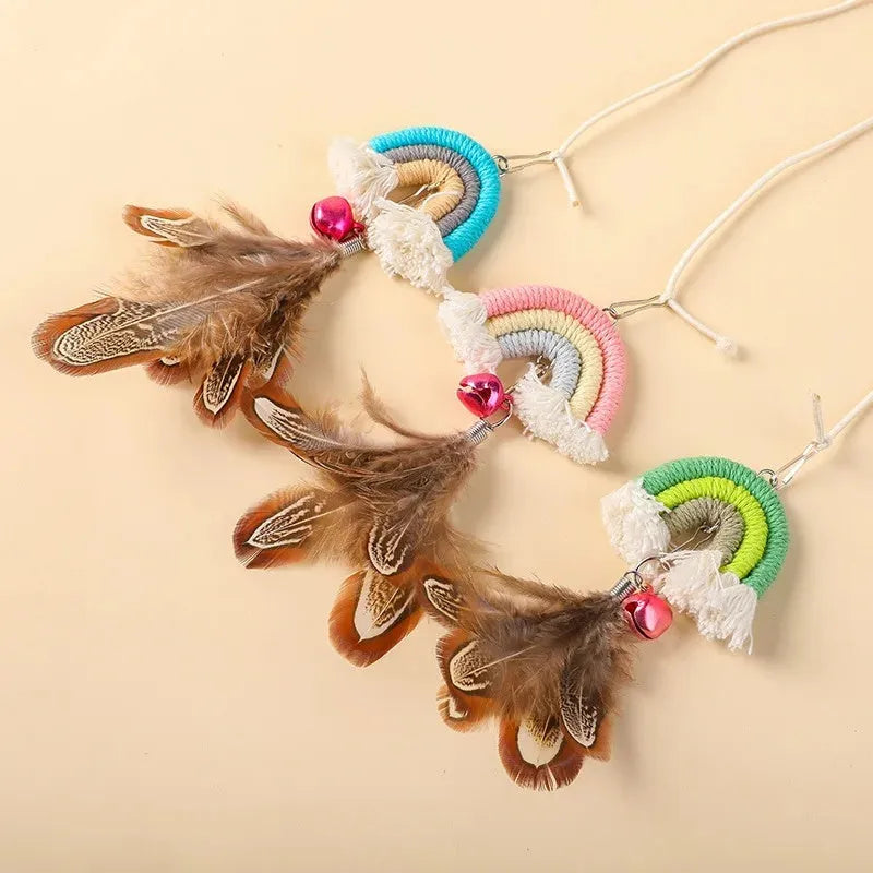 Blue feather cat rope toy hanging from a door with elastic swing and sticky buckle clamp