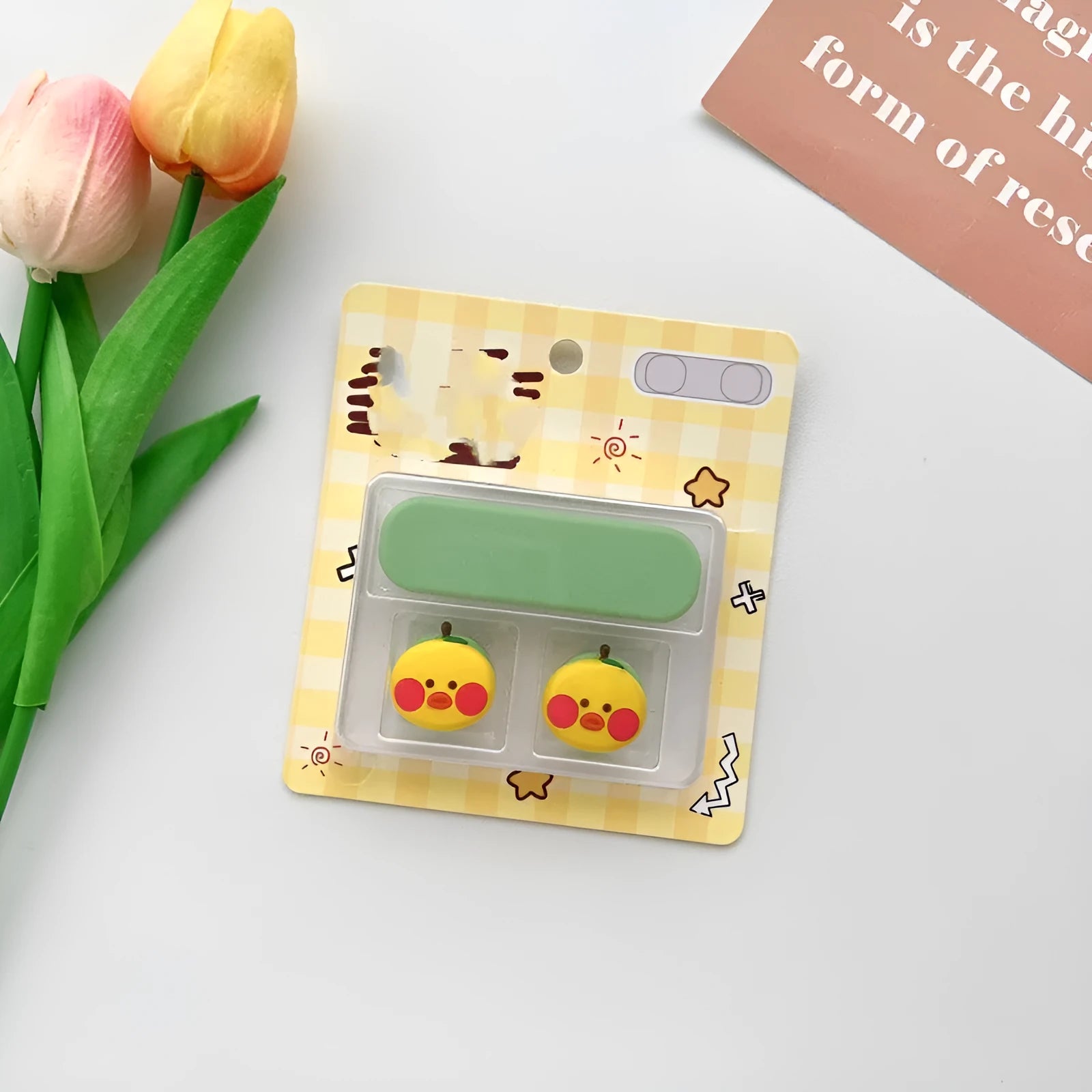 Cartoon-style plastic magnetic data cable fixer for desktop organisation.