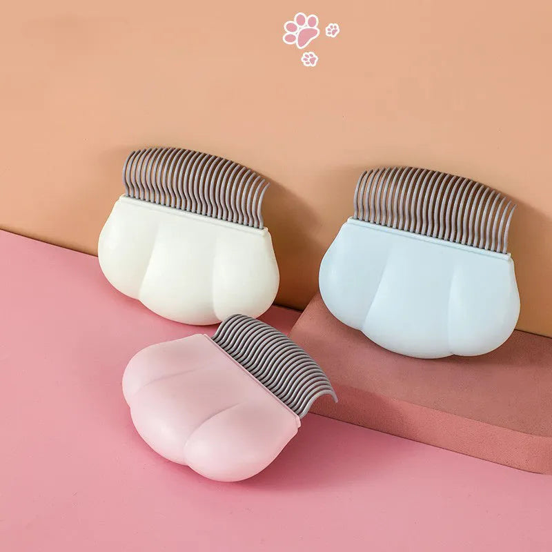Paw Soft deshedding brush for pets in blue, pink, or white, measuring 9cm.