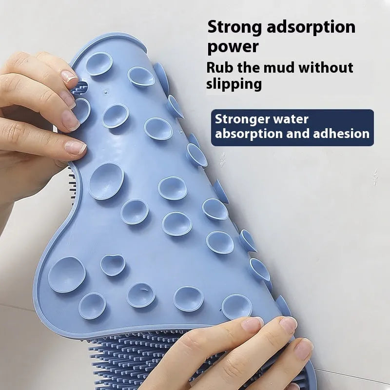 Blue silicone bath brush with curved handle for back scrubbing, measuring 31cm by 32cm