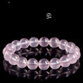 Women's polished crystal round bead bracelet in pink, showing single circle design with various size options.