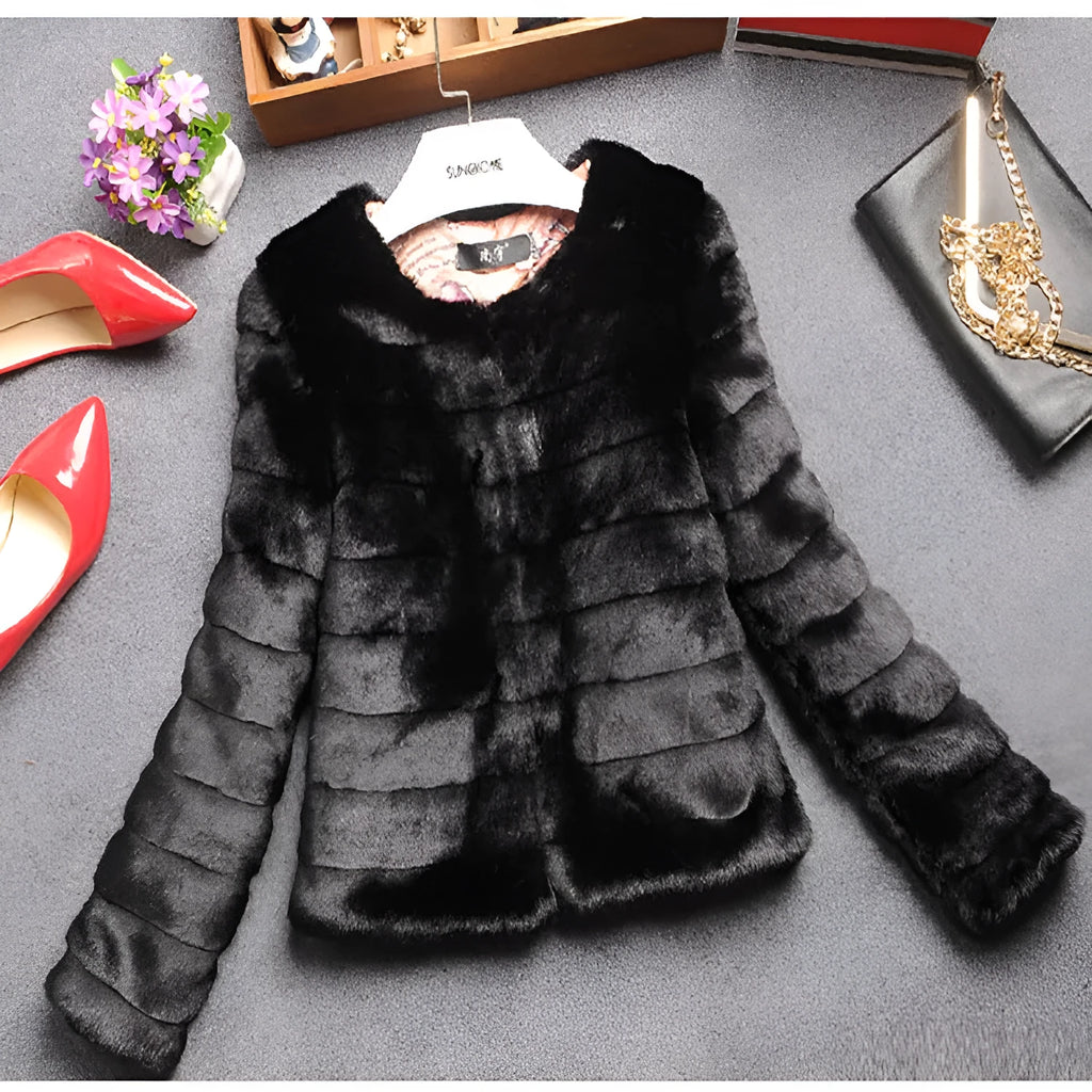 Women's short-length faux fur top in beige, black, or white with regular sleeves.