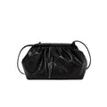Shell-shaped crossbody bag with hair clip shoulder strap showing multiple compartments including mobile phone pocket