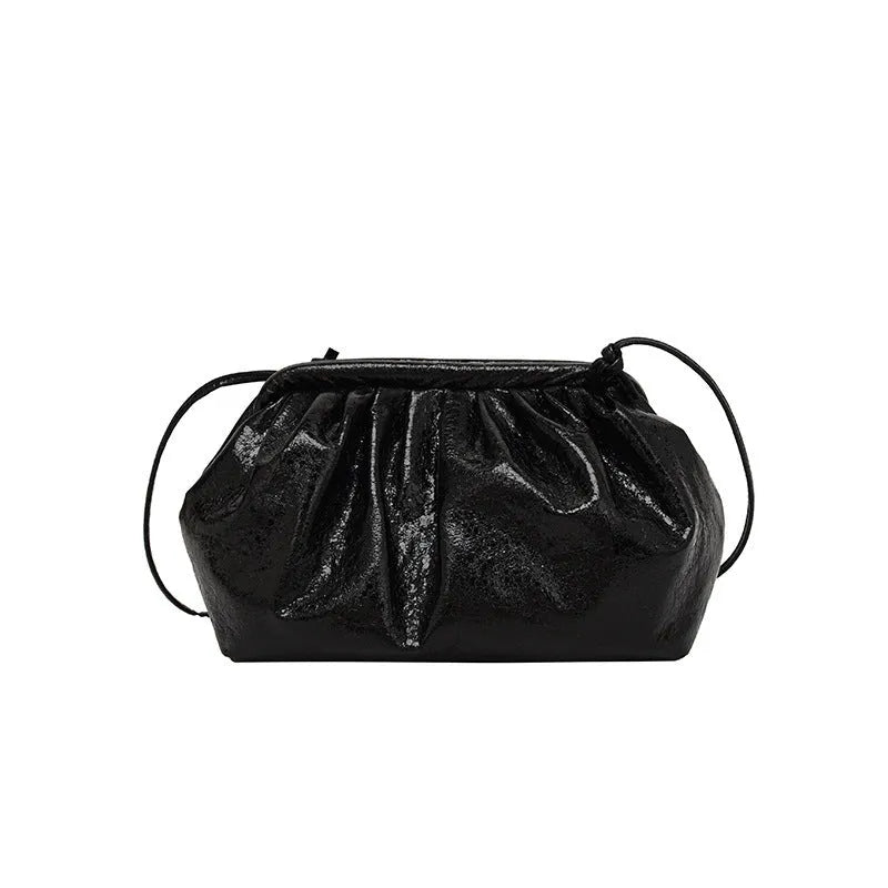 Shell-shaped crossbody bag with hair clip shoulder strap showing multiple compartments including mobile phone pocket