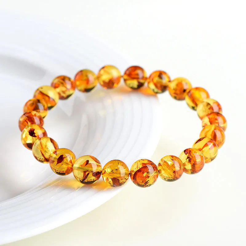 Natural yellow piebald amber bracelet with flower spot pattern for water purification