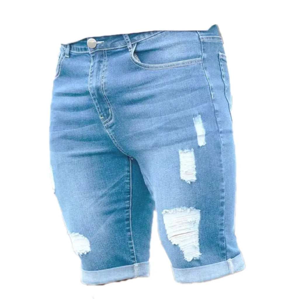 Sky blue men's denim shorts with a multi-hole distressed design and a straight leg.