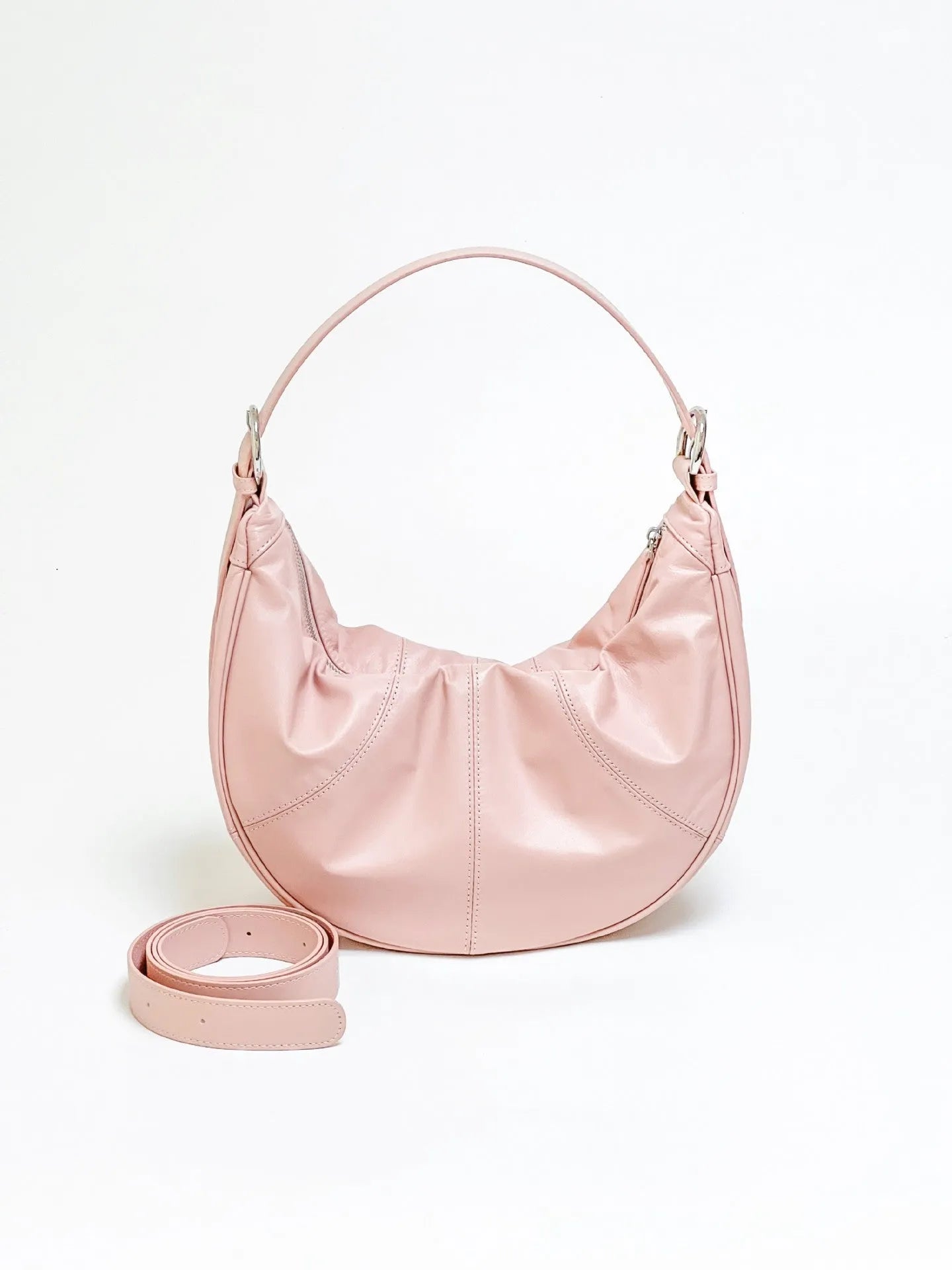 Women's soft cowhide leather dumpling-shaped shoulder bag in black with double straps and sandwich pockets.