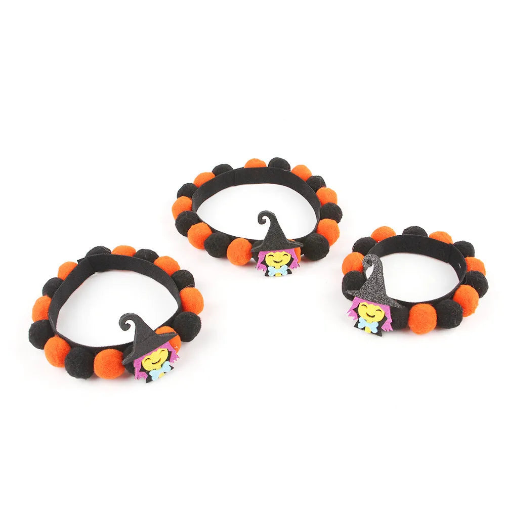 Halloween pet collar with a fur ball decoration in a pumpkin design, shown in size M