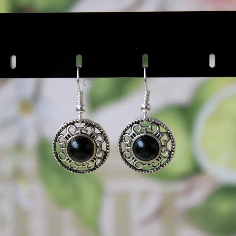 Handmade Miao silver turquoise earrings with geometric flower disk design and ethnic patterns