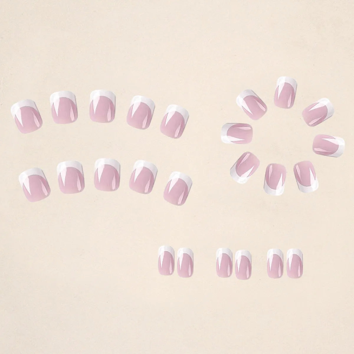 24 white square fake nails with a black and white plaid pattern, laid out on a surface.