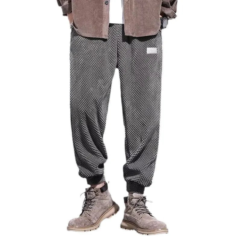 Men's grey straight leg sweatpants with an ankle-tie closure, laid flat.