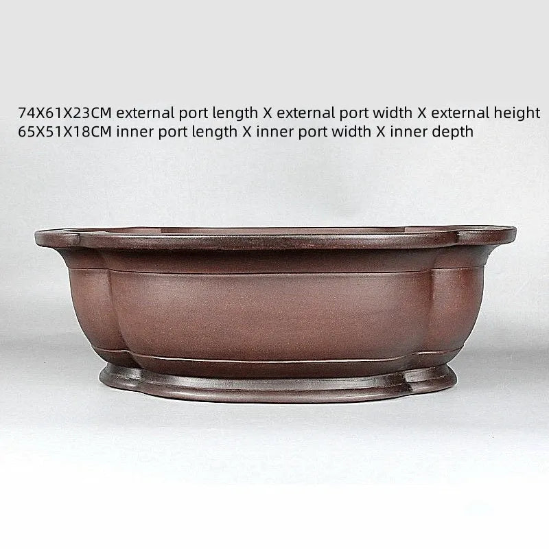 Handmade antique crabapple shaped purple clay flowerpot for plants.