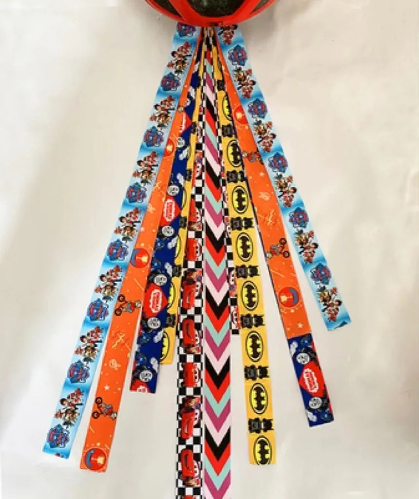Children's decorative helmet streamer ribbon in multiple colours for roller skating and skiing safety gear.