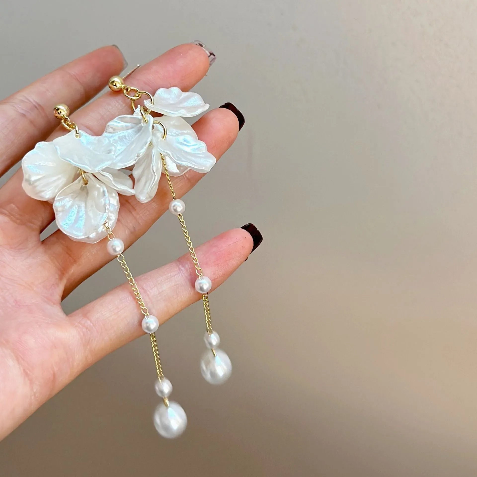 Women's acrylic shell pearl tassel earrings showing length, with a choice of four ear clip types.