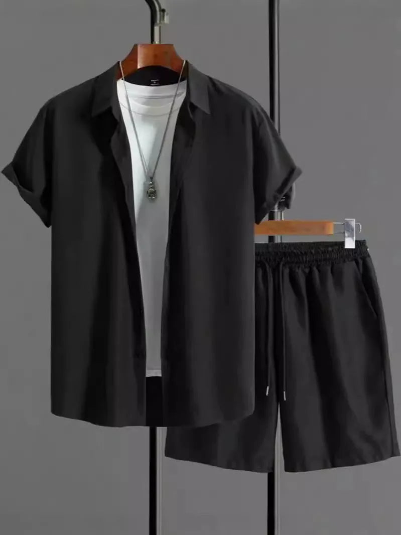 Man wearing black and white jacquard print short sleeve suit with shirt-style jacket and matching shorts