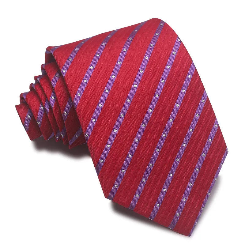 Close-up of a red, black, and blue striped men's formal tie with a textured Jacquard weave.
