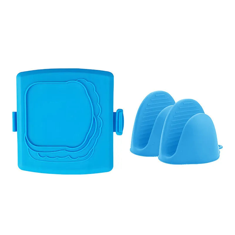 Red silicone baking tray with matching heat-resistant gloves on a kitchen counter.