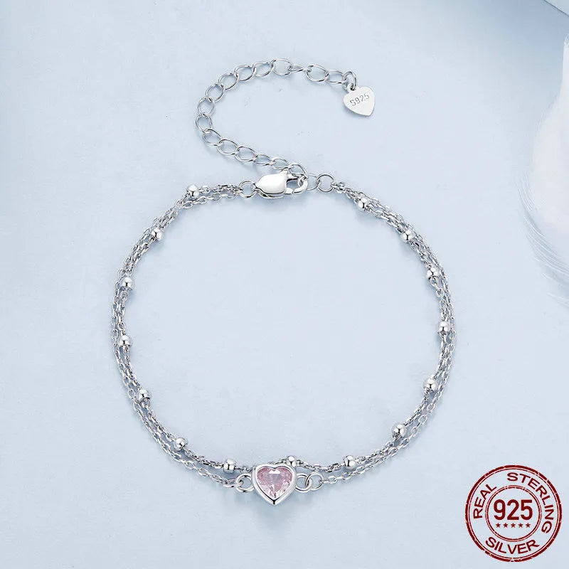 Women's 925 sterling silver bracelet with a small heart charm on an adjustable chain.