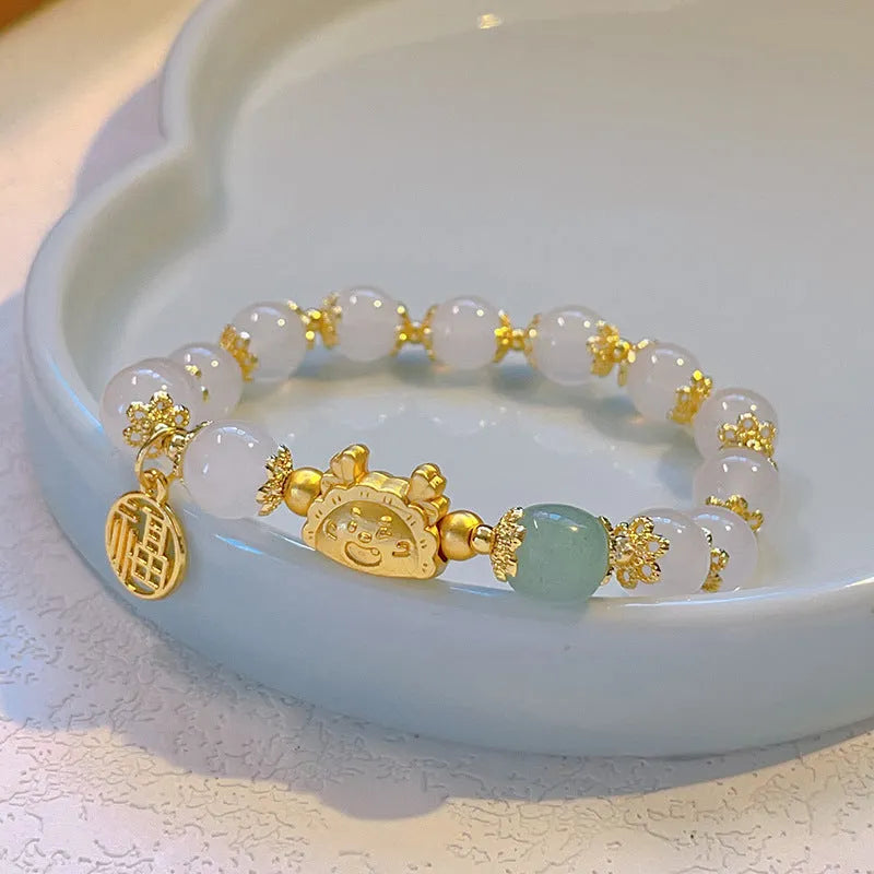 Floral glazed zodiac bracelet with glass beads and coloured glaze animal charm