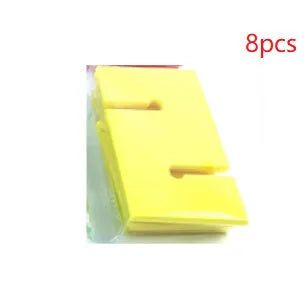 Set of coloured ABS plastic tower blocks with pull ropes and metal hook frame for outdoor team building games.