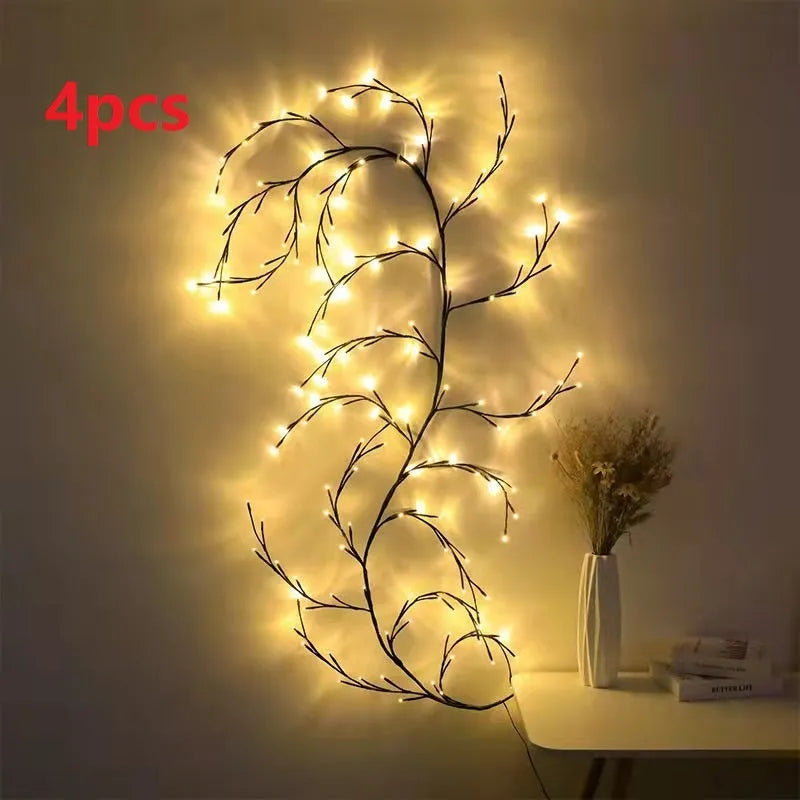 Flexible LED willow vine garland with warm white lights on birch-textured branches for wall and party decor.
