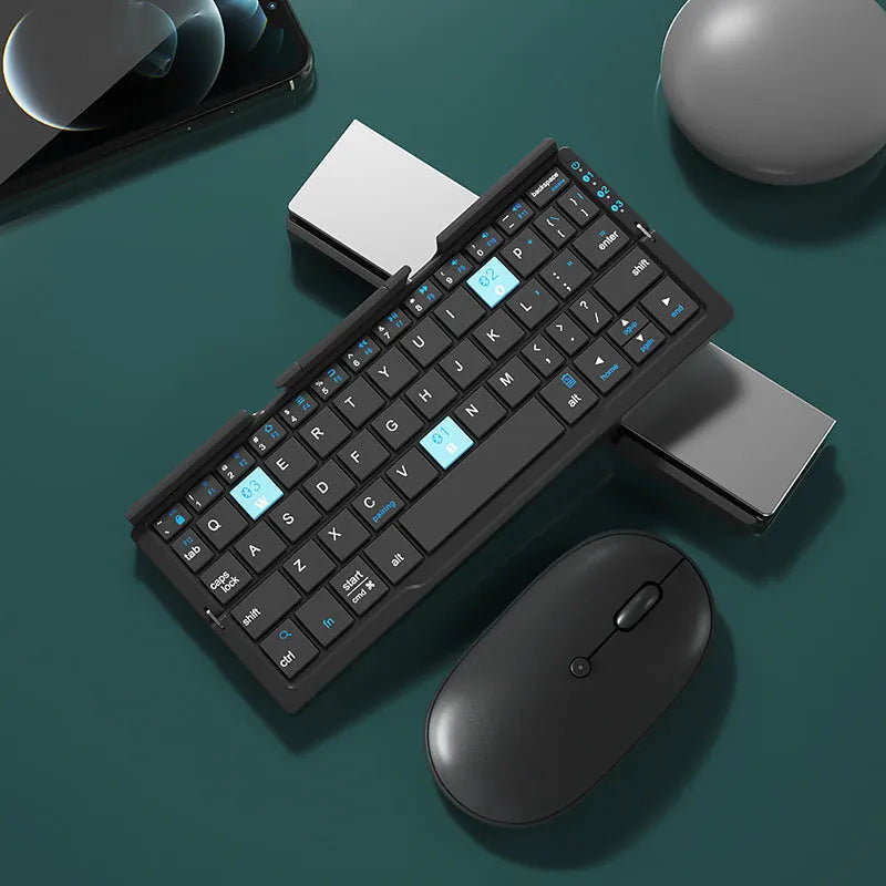 Aluminium folding Bluetooth keyboard open with smartphone on stand showing silver white finish