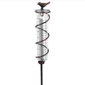 Traditional cast iron bird-shaped hyetometer with glass measurement cylinder showing 800ml capacity