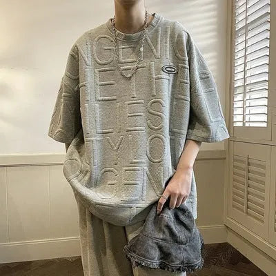 Men's grey retro t-shirt with raised letter print in loose fit short sleeve design